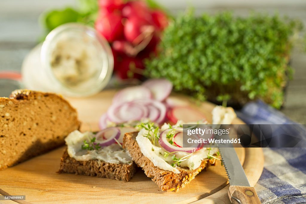 Lard bread garnished with, red radish, onion rings and cress