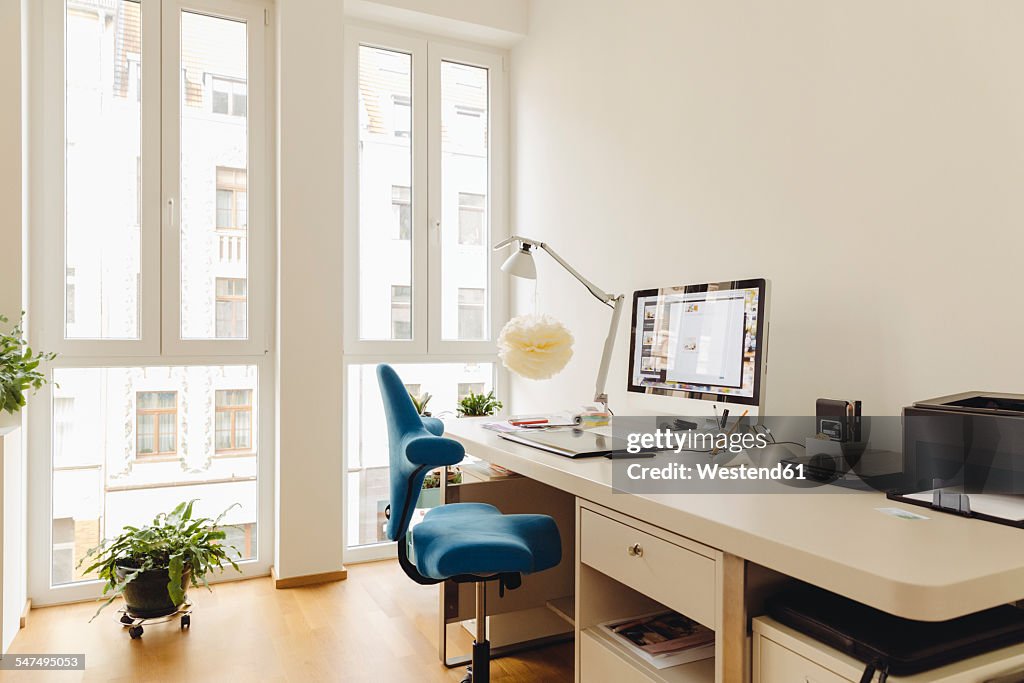 Home office with computer desk in modern building