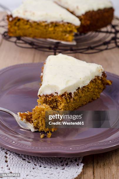 piece of carrot cake with lime topping - carrot cake stock pictures, royalty-free photos & images