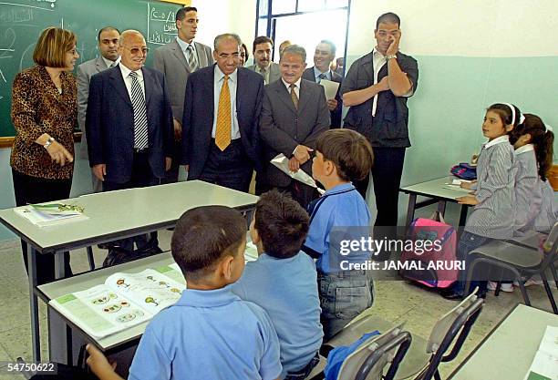 Palestinian Prime Minister Ahmed Qorei and other officials visit a primary school 05 September 2005 in the West Bank city of Ramallah. Jordan denied...