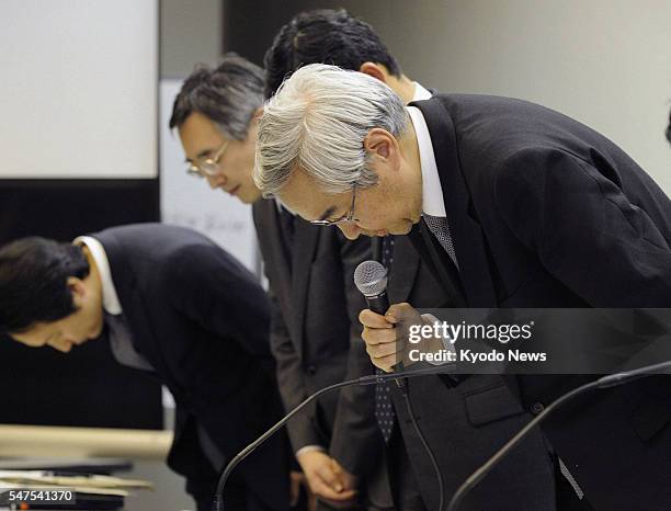 Japan - Tokyo Electric Power Co. Vice President Sakae Muto and other executives of Japan's largest power utility bow to apologize over a crisis at...