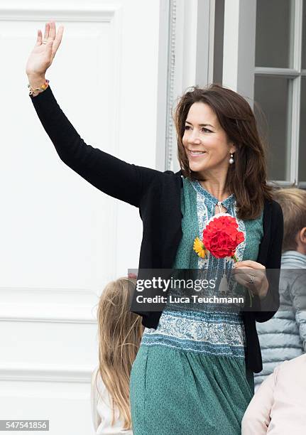 Crown Princess Mary of Denmark waves to the photographers at the annual summer photo call for The Danish Royal Family at Grasten Castle on July 25,...