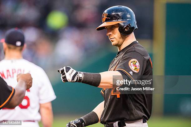 Nolan Reimold of the Baltimore Orioles celebrates after reaching first during the fifth inning against the Cleveland Indians at Progressive Field on...