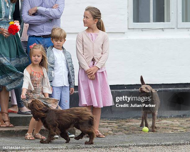 Princess Josephine and Prince Vincent of Denmark, and Princess Isabella of Denmark, attend the annual summer photo call for The Danish Royal Family...