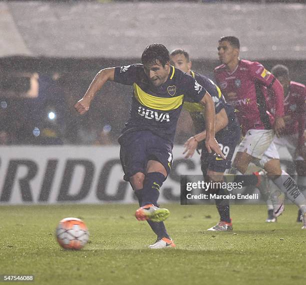 Nicolas Lodeiro of Boca Juniors kicks the ball from the penalty spot during a second leg match between Boca Juniors and Independiente del Valle as...
