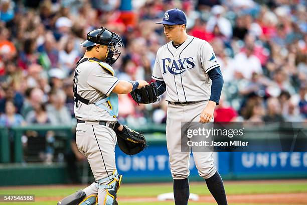 Catcher Hank Conger of the Tampa Bay Rays talks to starting pitcher Blake Snell during the fourth inning against the Cleveland Indians at Progressive...