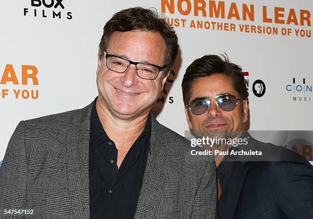 Actors Bob Saget and John Stamos attend the premiere of "Norman Lear: Just Another Version Of You" at The WGA Theater on July 14, 2016 in Beverly...