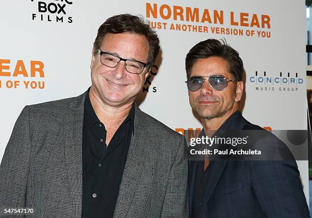 Actors Bob Saget and John Stamos attend the premiere of "Norman Lear: Just Another Version Of You" at The WGA Theater on July 14, 2016 in Beverly...