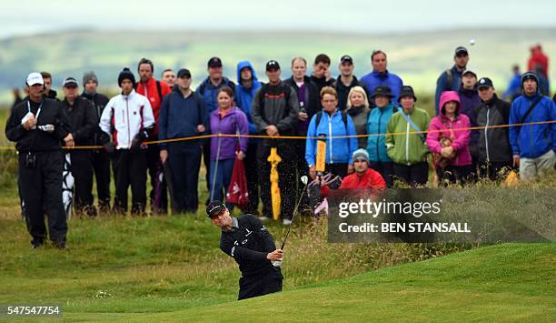 Golfer Zach Johnson chips from the sand on the 15th hole during his second round on day two of the 2016 British Open Golf Championship at Royal Troon...