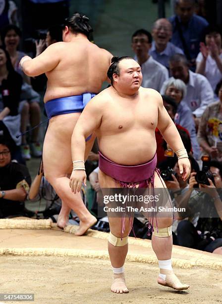 Takarafuji reacts after winning against Shodai during day six of the Grand Sumo Nagoya Tournament at the Aichi Prefecture Gymnasium on July 15, 2016...