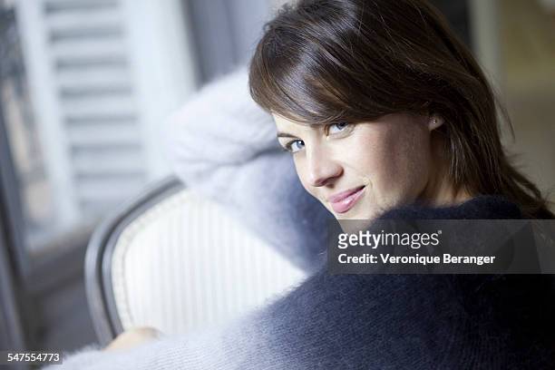 woman at her home - soft smile stock pictures, royalty-free photos & images