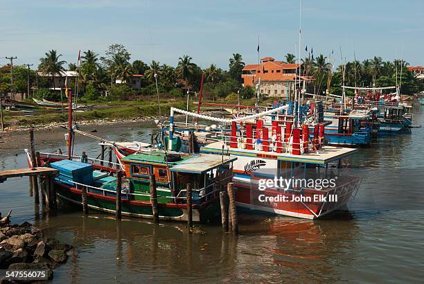 negombo lagoon scene with fishing boats - western province sri lanka stock pictures, royalty-free photos & images