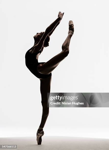 ballerina attitude on pointe - pointe stock pictures, royalty-free photos & images