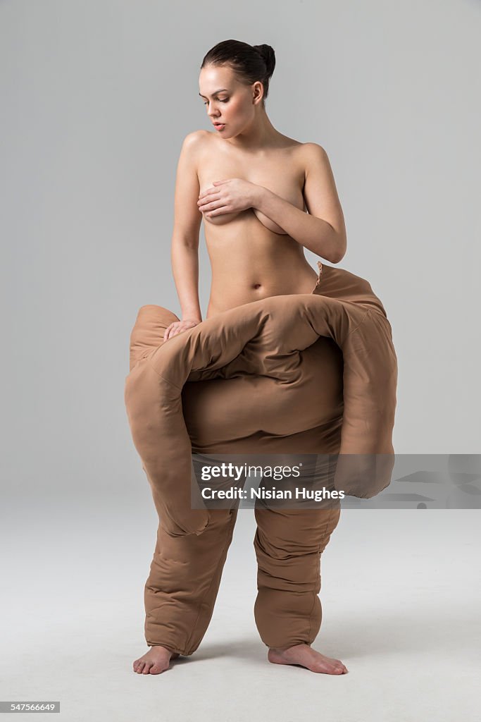 Woman pulling off fat suit