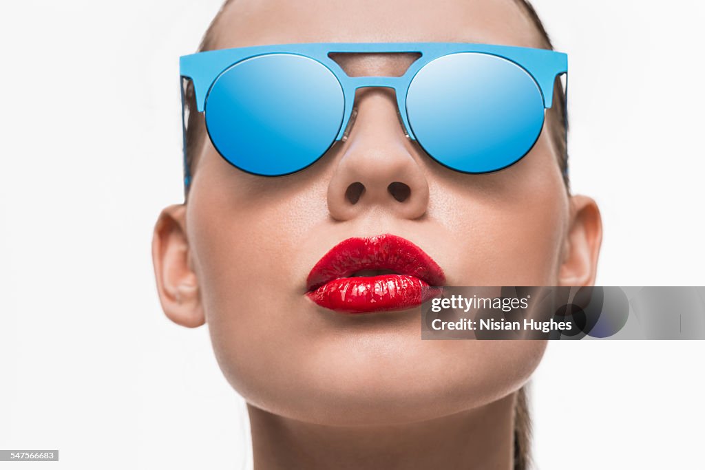 Portrait of woman with blue sunglasses