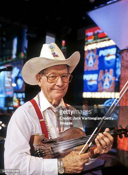 Portrait of American Cajun fiddler Luderin Darbone , leader of the Hackberry Ramblers, as he poses at MTV Studios, New York, New York, February 23,...