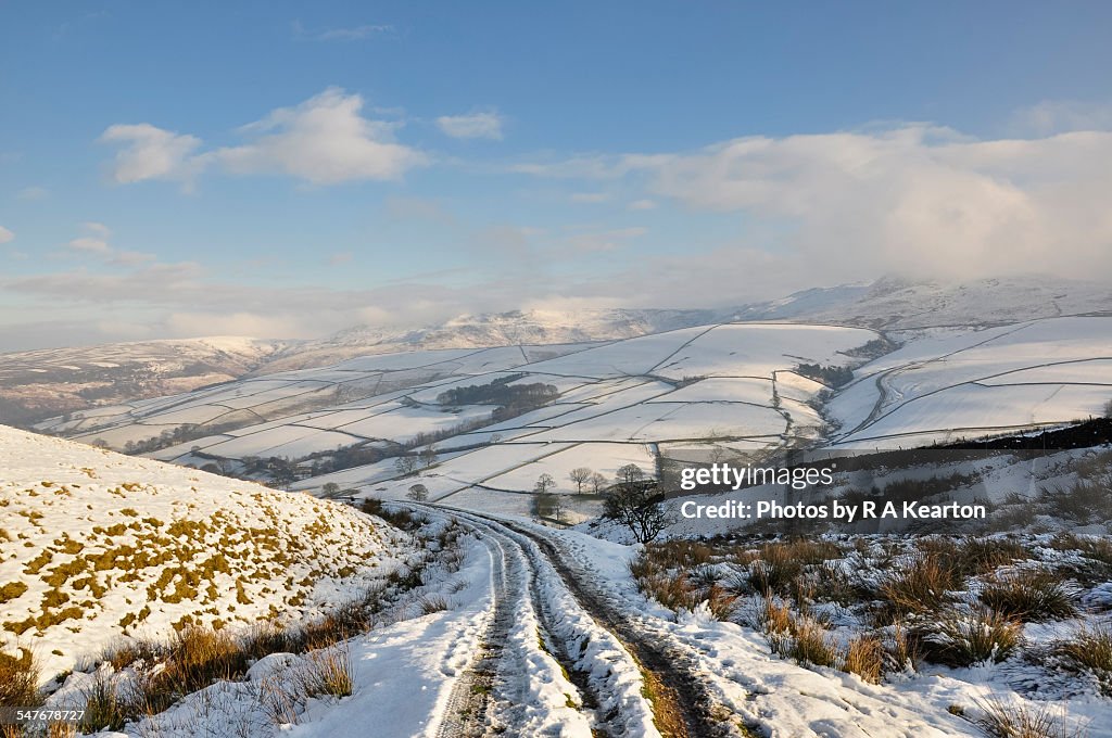 Snowy hillside track in a winter landscape