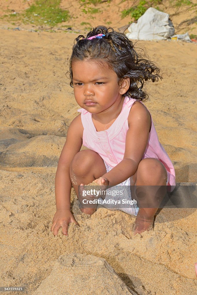 Baby playing with sand