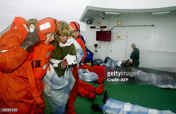 "Wounded" vicirms are aided as the rescue Excercise "Barents Rescue" unfolds near Honningsvag in Northern Norway 05 September 2005. The scenario was...