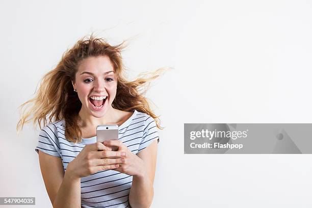 woman using phone - tangled stock-fotos und bilder