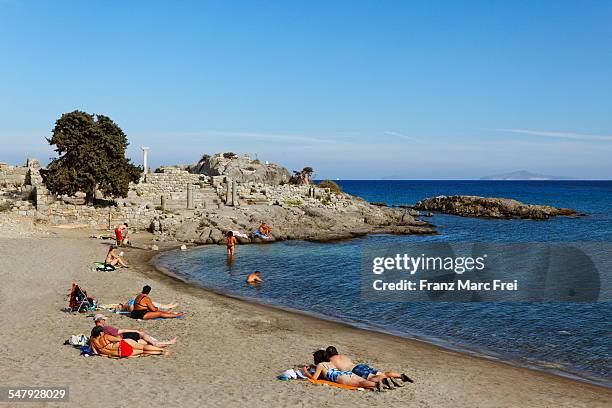 beach and excarvations, kamari - kamari beach santorini stock pictures, royalty-free photos & images