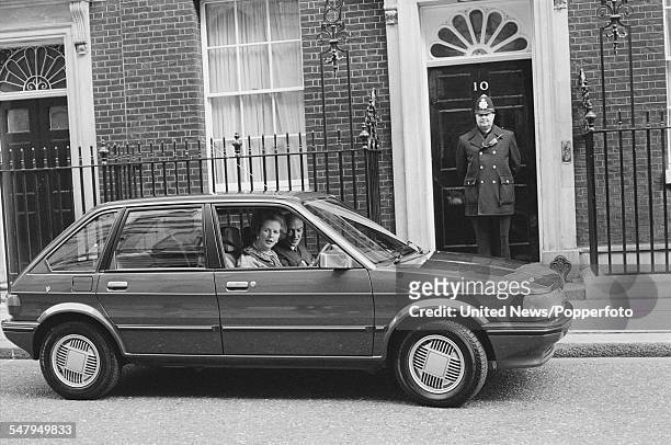 British Prime Minister Margaret Thatcher pictured sitting in the driver's seat of a newly launched British Leyland Austin Maestro car outside 10...