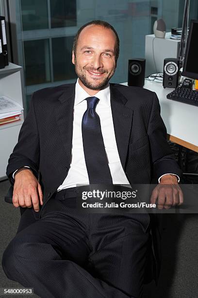 businessman in office - grossi stock pictures, royalty-free photos & images