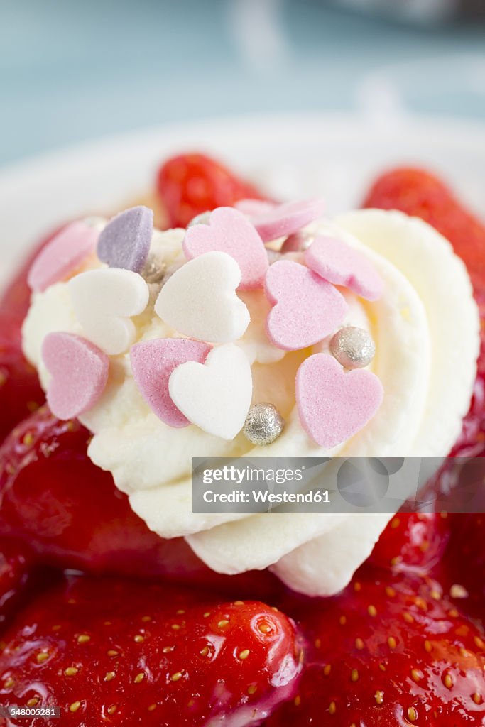 Strawberry tartlet with cream and baking decor, detail