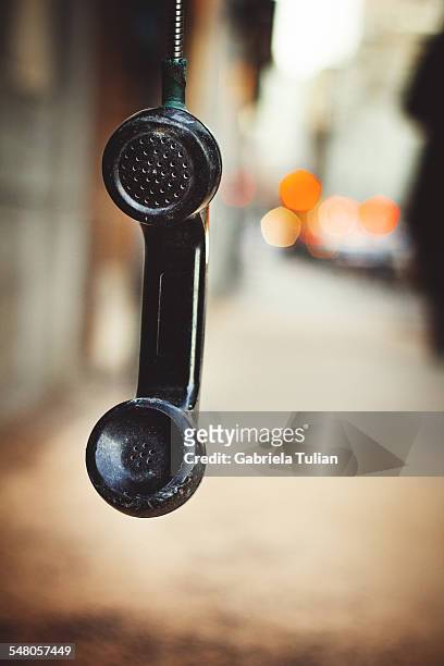 phone handset off hook hanging by the chord - telefono stock pictures, royalty-free photos & images