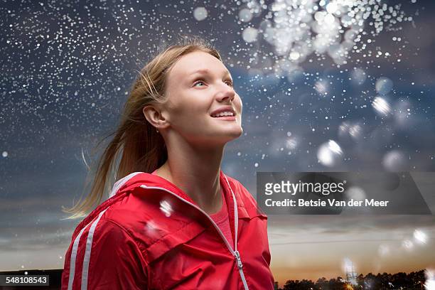 young woman looks at star dust  in sky. - awe stock pictures, royalty-free photos & images