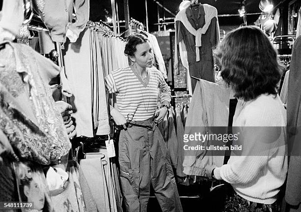 Economy, retail trade, customer and salesgirl in a fashion boutique, aged 20 to 30 years -