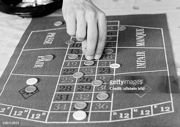 Freetime, gambling, roulette table with chips -
