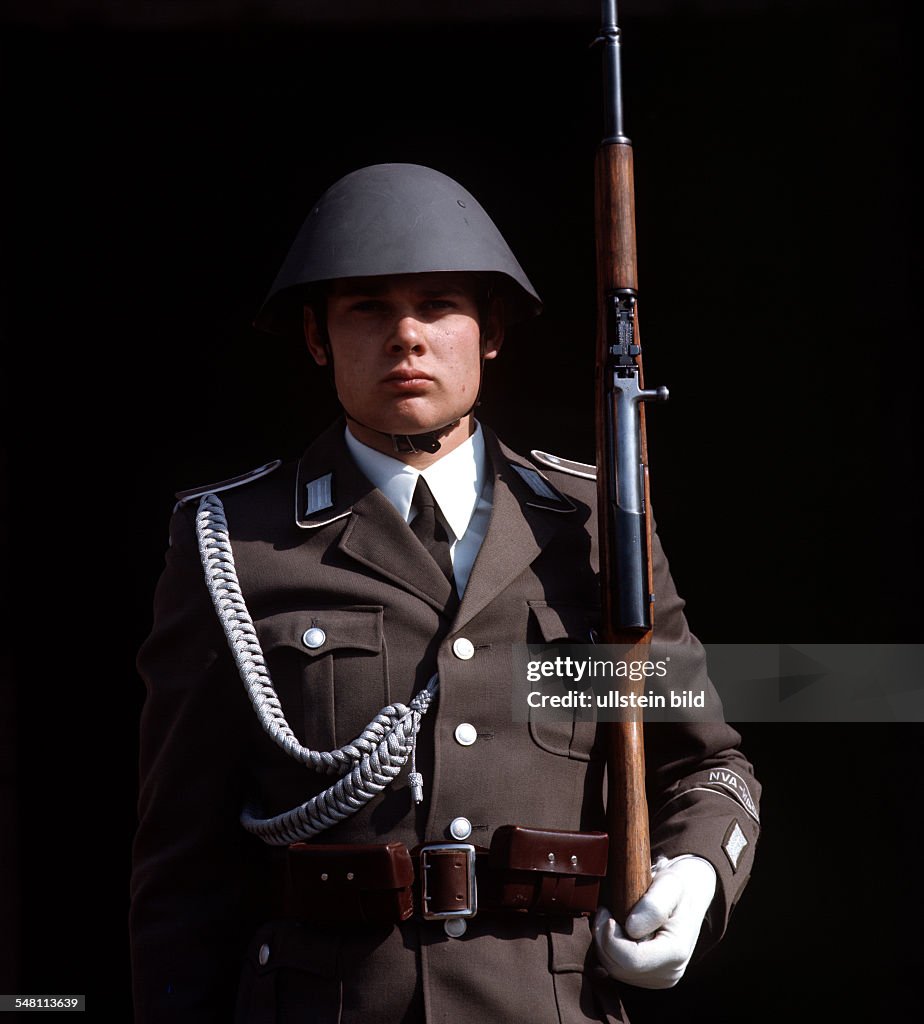 German Democratic Republic Bezirk Berlin (Ost-Berlin) East Berlin - Soldier of the National Peoples Army (NVA) during guard of honour in front of the cenotaph "Neue Wache" Unter den Linden.