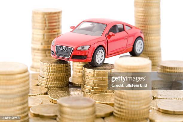 Germany - : symbolic photo scrapping bonus, environment bonus, automobile insurance, model of a car and Euro coins