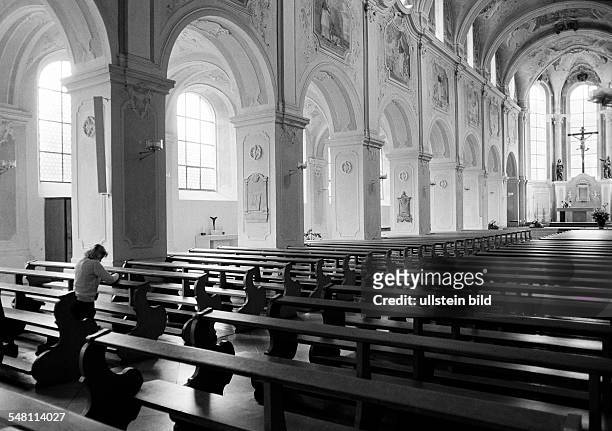 Religion, Christianity, young woman kneels in a pew and prays, aged 30 to 35 years, Elisabeth -