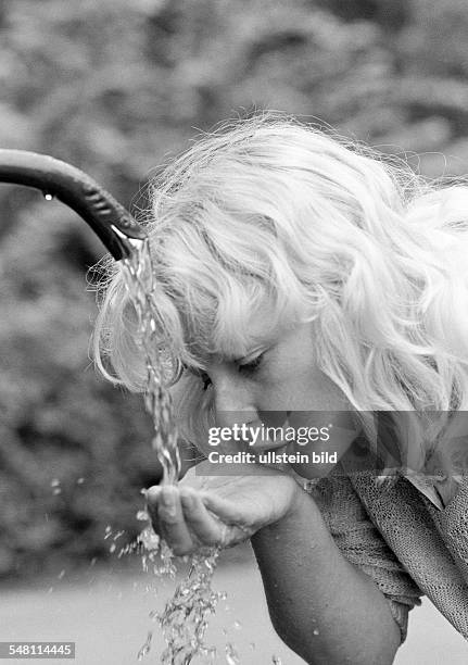 People, young woman drinks water from a spring, refreshment, cooling, portrait, blond, aged 30 to 35 years, Elisabeth -