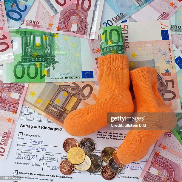 Request of child benefit, baby socks and Euro banknotes and coins