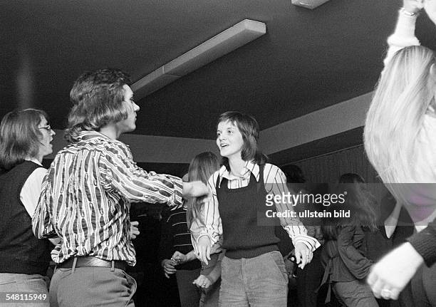 People, young couple in a disco, dancing, aged 16 to 20 years -
