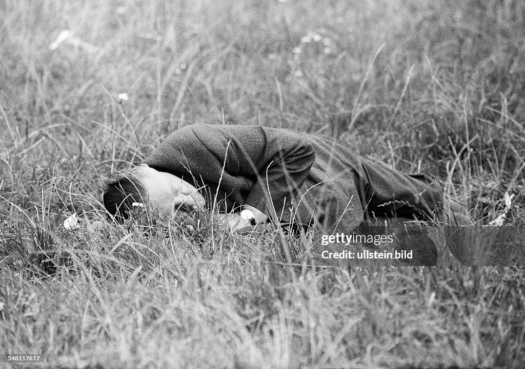 People, older man lies on a meadow and sleeps of, drunken, groggily, Munich Beer Festival 1966, aged 50 to 60 years, Munich, Upper Bavaria, Bavaria - 30.09.1966