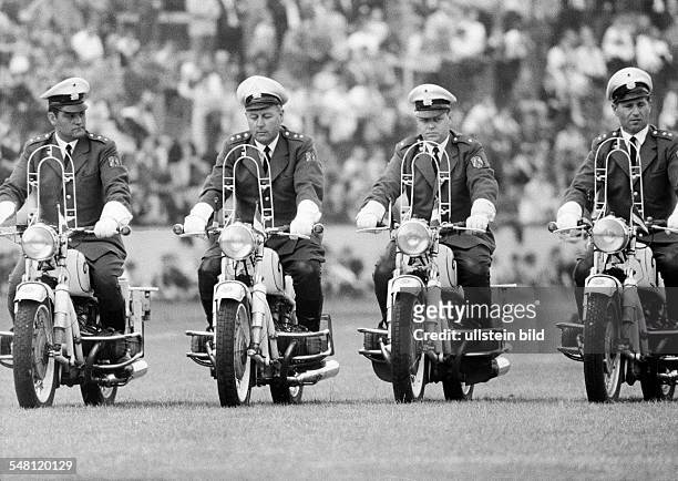 Event, 3rd International Police Sports and Music Festival 1966 in the Niederrhein Stadium in Oberhausen, four policeman on motorbikes drive in...