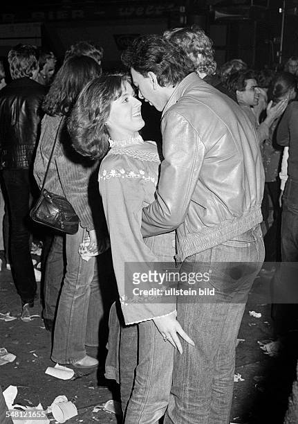 People, young couple in a disco, dancing, embracement, aged 18 to 25 years -