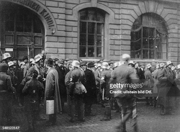 Nazi paramilitaries arrest city councilors as well as the Lord Mayor of Munich, Eduard Schmid during the Beer Hall Putsch, the Nazi Party's failed...