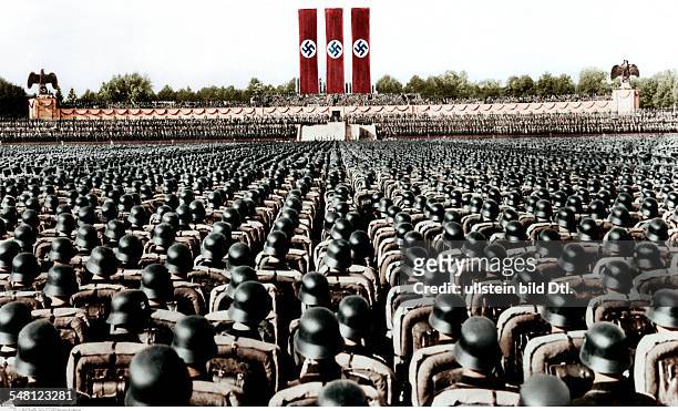 Germany, Third Reich - NSDAP Nuremberg Rally 1936 Parade of the NS-Driver's Corps, the SA and the SS at the rally ground; - digitally colorized...