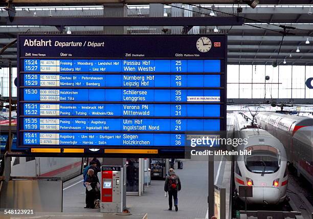 Germany Bavaria Munich - Munich Central Station. Zuganzeigetafel with the departure times of trains and regional trains. ICE 3 and regional train at...