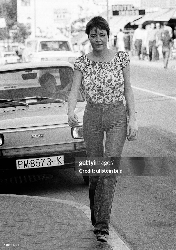 People, young woman on the pavement, blouse, jeans trousers, parking car, aged 22 to 28 years, Spain, Balearic Islands, Majorca, Palma de Majorca - 10.10.1978