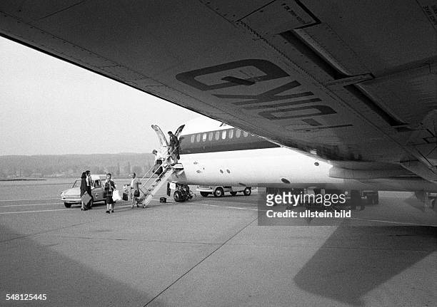 Airport Zurich, airline passengers leave the airplane and walk across the apron to the terminal building, Switzerland, Zurich -