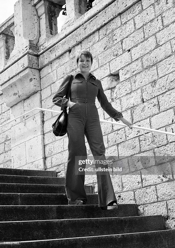People, young woman on a staircase, stone stairs, handrail, wall, trouser suit, aged 25 to 30 years, France, Loire Valley, Loir-et-Cher, Blois - 31.07.1979
