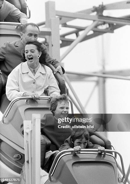 People, family on the kermess, Munich Beer Festival 1966, fun with a roller coaster ride, man, aged 35 to 40 years, woman, aged 30 to 35 years, girl,...