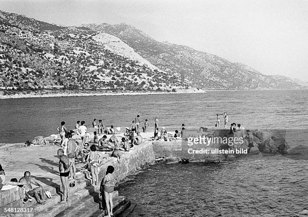Holidays, tourism, bathing tourists, people take a sunbath, Croatia, at that time Jugoslavia, Yugoslavia, Mediterranian Sea, Adriatic Sea -