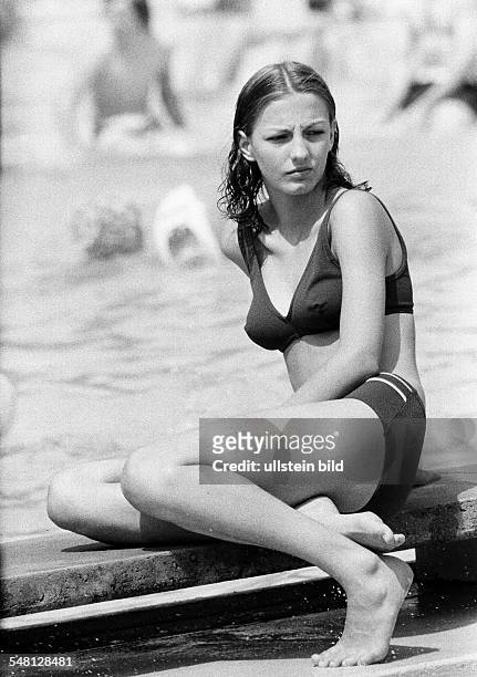 People, young girl in a bikini in an open-air bath, aged 18 to 22 years -